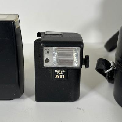 LOT 107L: Vintage Camera Lenses, Film, Filters, Flashes & More Accessories