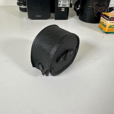 LOT 107L: Vintage Camera Lenses, Film, Filters, Flashes & More Accessories