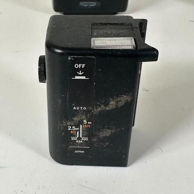 LOT 107L: Vintage Camera Lenses, Film, Filters, Flashes & More Accessories