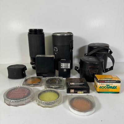 LOT 107L: Vintage Camera Lenses, Film, Filters, Flashes & More Accessories