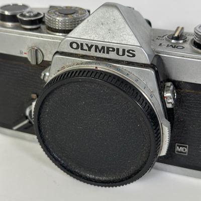 LOT 108L: Two Olympus OM-1 Cameras & OM10