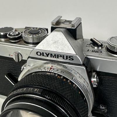 LOT 108L: Two Olympus OM-1 Cameras & OM10