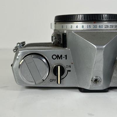 LOT 108L: Two Olympus OM-1 Cameras & OM10
