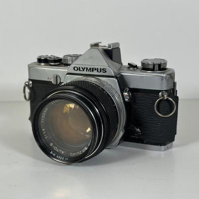 LOT 108L: Two Olympus OM-1 Cameras & OM10