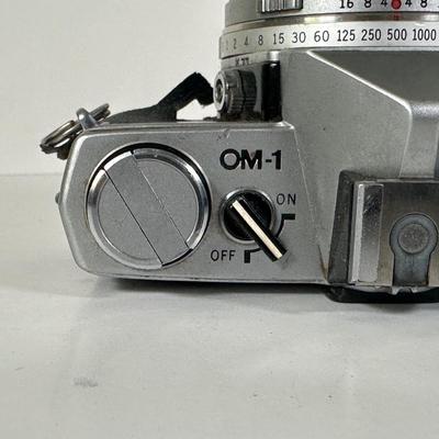 LOT 108L: Two Olympus OM-1 Cameras & OM10