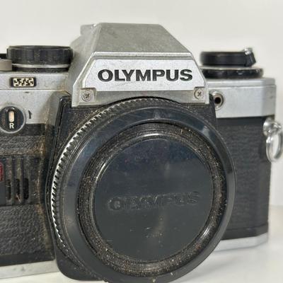 LOT 108L: Two Olympus OM-1 Cameras & OM10