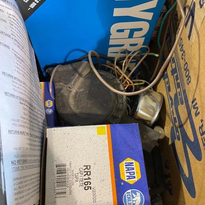 Lot 411 windshield scrapers, oil filters, carburtator repair kit,oversized load sign