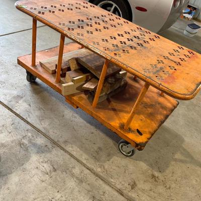 Lot 413 orange wood cart (Looks to be from Home Depot) with wood scraps