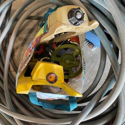 Lot 430 fishing waders, yard hoses and numerous sprinklers