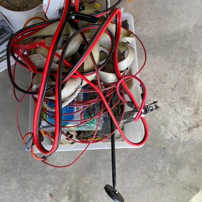 Lot 438 box of tie down straps, bungee cords and jumper cables