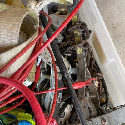 Lot 438 box of tie down straps, bungee cords and jumper cables
