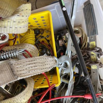 Lot 438 box of tie down straps, bungee cords and jumper cables
