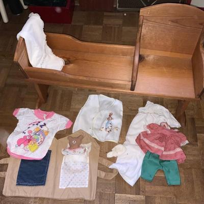 Vintage wooden cradle for toddler and doll. Includes matching nightgown and blanket.