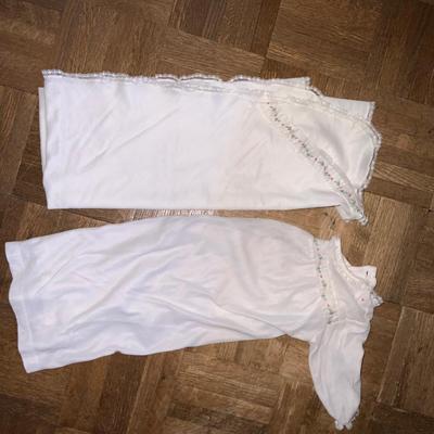 Vintage wooden cradle for toddler and doll. Includes matching nightgown and blanket.