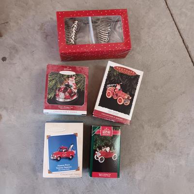 HALLMARK ORNAMENTS W/SANTA IN THE DRIVERS SEAT PLUS SANTAS BOOTS FROM DILLARDS