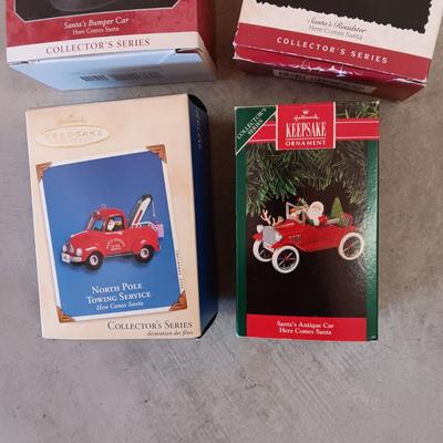 HALLMARK ORNAMENTS W/SANTA IN THE DRIVERS SEAT PLUS SANTAS BOOTS FROM DILLARDS