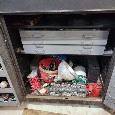 Rolling cabinet filled with tools with electrical receptacles