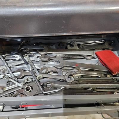 Rolling cabinet filled with tools with electrical receptacles