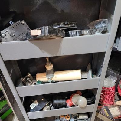 Rolling cabinet filled with tools with electrical receptacles