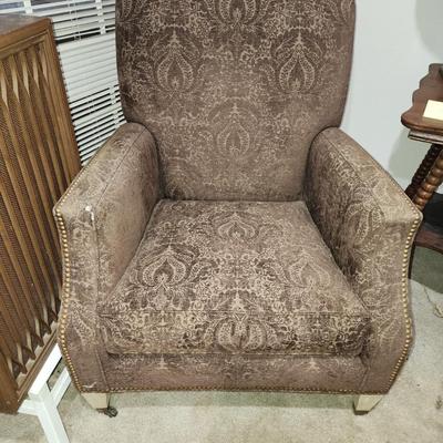 Chocolate brown side chair on wheels.