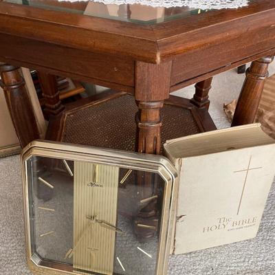 6 sided glass top table, clock and Bible