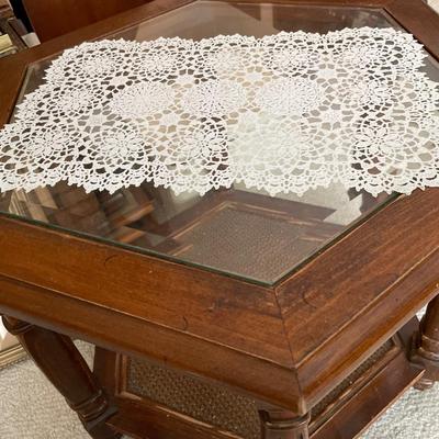 6 sided glass top table, clock and Bible