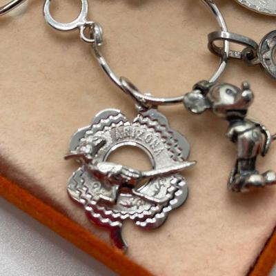 LOT 238: Sterling Silver / Silver Tone Jewelry Charm Collection - Mickey Mouse, Tinkerbell and More