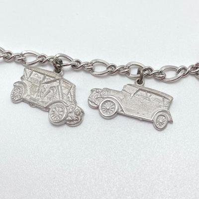 LOT 239: Sterling Silver AAA Charm Bracelet - TW 25.85g