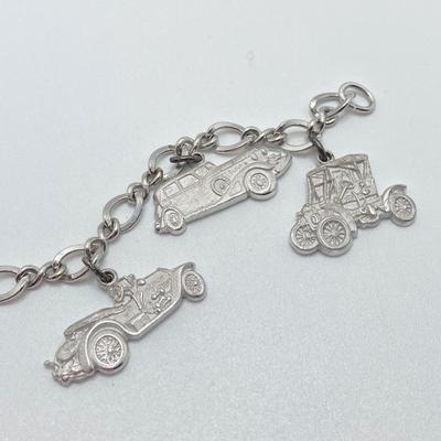LOT 239: Sterling Silver AAA Charm Bracelet - TW 25.85g
