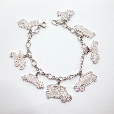 LOT 239: Sterling Silver AAA Charm Bracelet - TW 25.85g