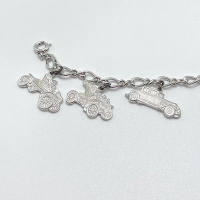 LOT 239: Sterling Silver AAA Charm Bracelet - TW 25.85g