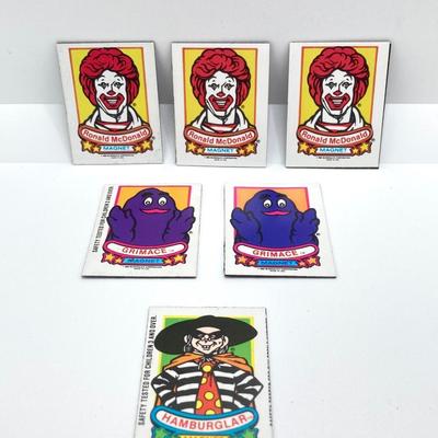 LOT 242: Large Vintage McDonald's Memorabilia Collection - Ronald McDonald Watch in Package, Pins, Stickers, Magnetics,