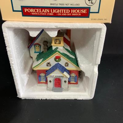 LOT 254:Large Assortment of Lemax Hearthside Village Houses and Figurines