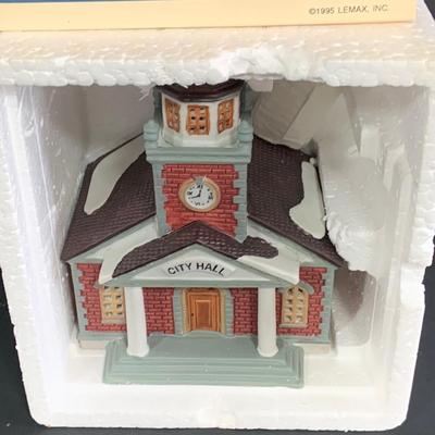 LOT 254:Large Assortment of Lemax Hearthside Village Houses and Figurines