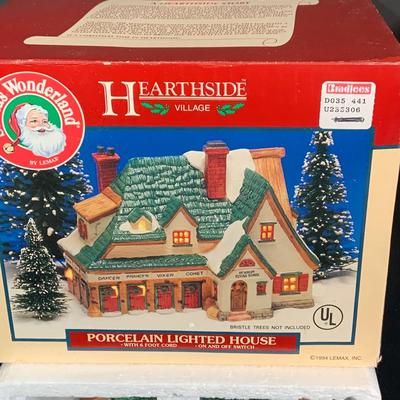 LOT 254:Large Assortment of Lemax Hearthside Village Houses and Figurines