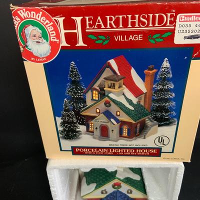 LOT 254:Large Assortment of Lemax Hearthside Village Houses and Figurines