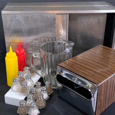 LOT 257: Diner Collection Includes Vintage Napkin Dispenser, Salt and Pepper Shakers, Vintage Alunimum Bread Box, Pitcher, and More