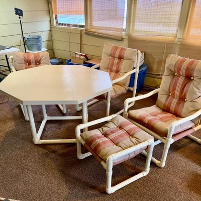 LOT 261: Mid Century PVC Patio Furniture Including Octogon Table, a Reclining Chair and Ottoman and Two Arm Chairs