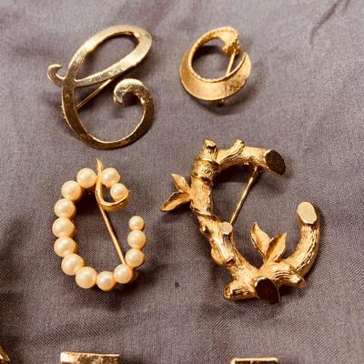LOT 267: Whimsical Collection of Goldtone Brooches and Pins Including Holiday and More