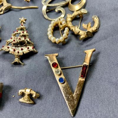 LOT 267: Whimsical Collection of Goldtone Brooches and Pins Including Holiday and More