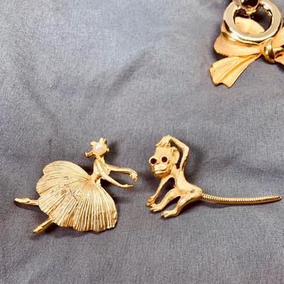 LOT 267: Whimsical Collection of Goldtone Brooches and Pins Including Holiday and More