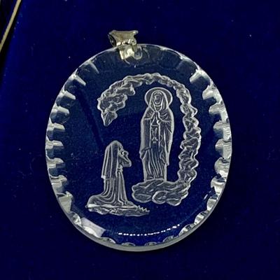 LOT 270: Religous Crystal Pendants Including Shrine of Our Lady of the Snow Crystal Pendant. Crystal Cut Hear Pendant with Sterling...