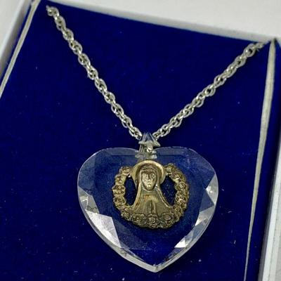 LOT 270: Religous Crystal Pendants Including Shrine of Our Lady of the Snow Crystal Pendant. Crystal Cut Hear Pendant with Sterling...