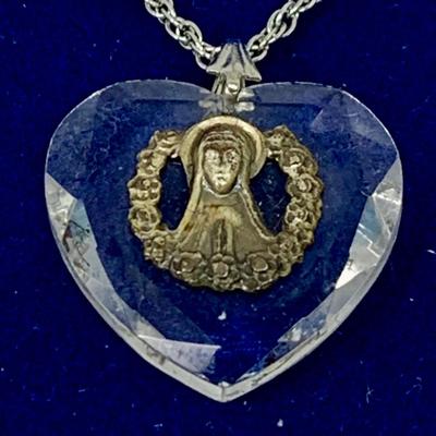 LOT 270: Religous Crystal Pendants Including Shrine of Our Lady of the Snow Crystal Pendant. Crystal Cut Hear Pendant with Sterling...