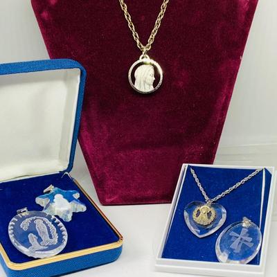 LOT 270: Religous Crystal Pendants Including Shrine of Our Lady of the Snow Crystal Pendant. Crystal Cut Hear Pendant with Sterling...