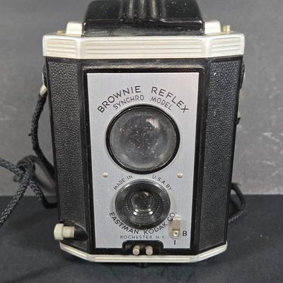 LOT 275: Kodak BROWNIE REFLEX SYNCHRO MODEL Camera and Vintage WOLLENSAK 8MM MAGAZINE MODEL 73 MOVIE CAMERA ; Both Untested