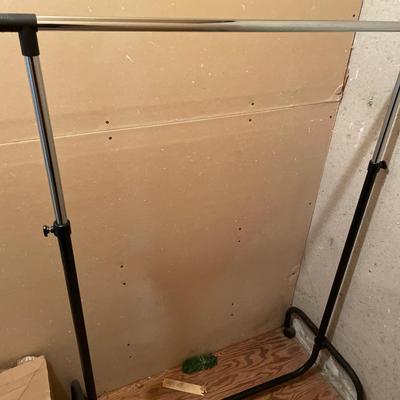 Adjustable rolling clothes rack