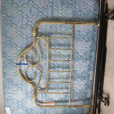 Queen Sized bed with decorative brass headboard