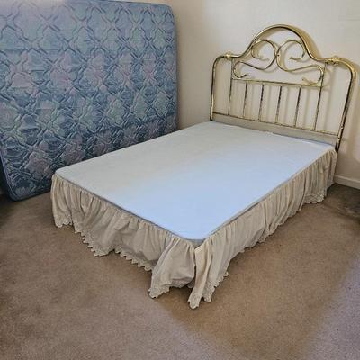 Queen Sized bed with decorative brass headboard