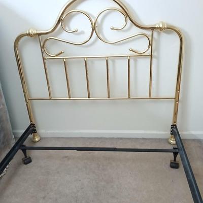 Queen Sized bed with decorative brass headboard